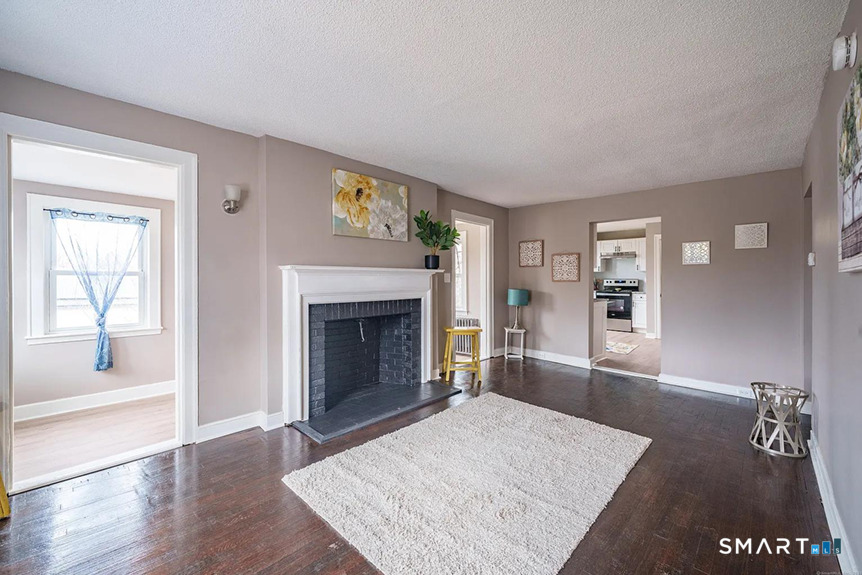 73 Silver Street Middletown, CT 06457 - Photo 5 of 30 a living room with furniture and a fireplace