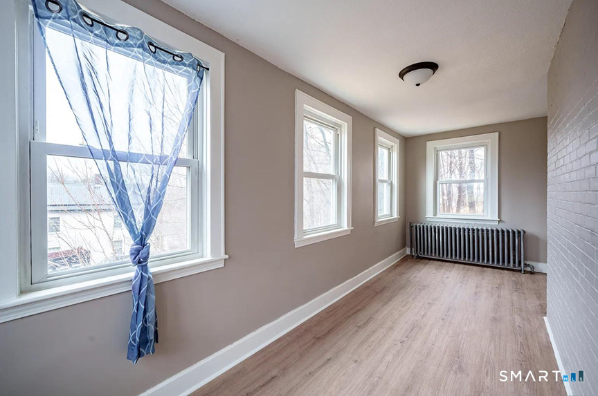 73 Silver Street Middletown, CT 06457 - Photo 10 of 30 a view of empty room with wooden floor and fan