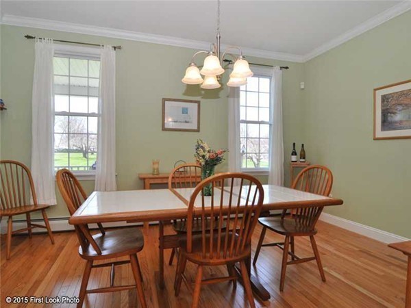 4196 Main Road Tiverton, RI 02878 - Photo 15 of 26 a view of a dining room with furniture window and wooden floor