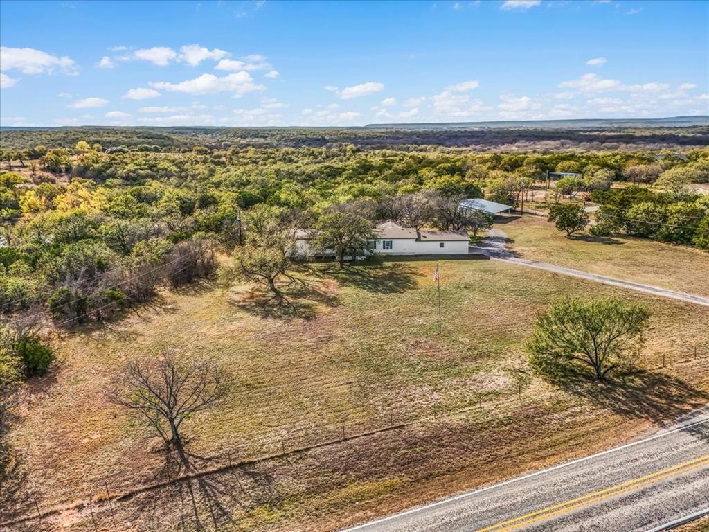 1956 North FM 129 Santo, TX 76472 - Photo 2 of 30 Aerial view of property's home from the road frontage, FM 129