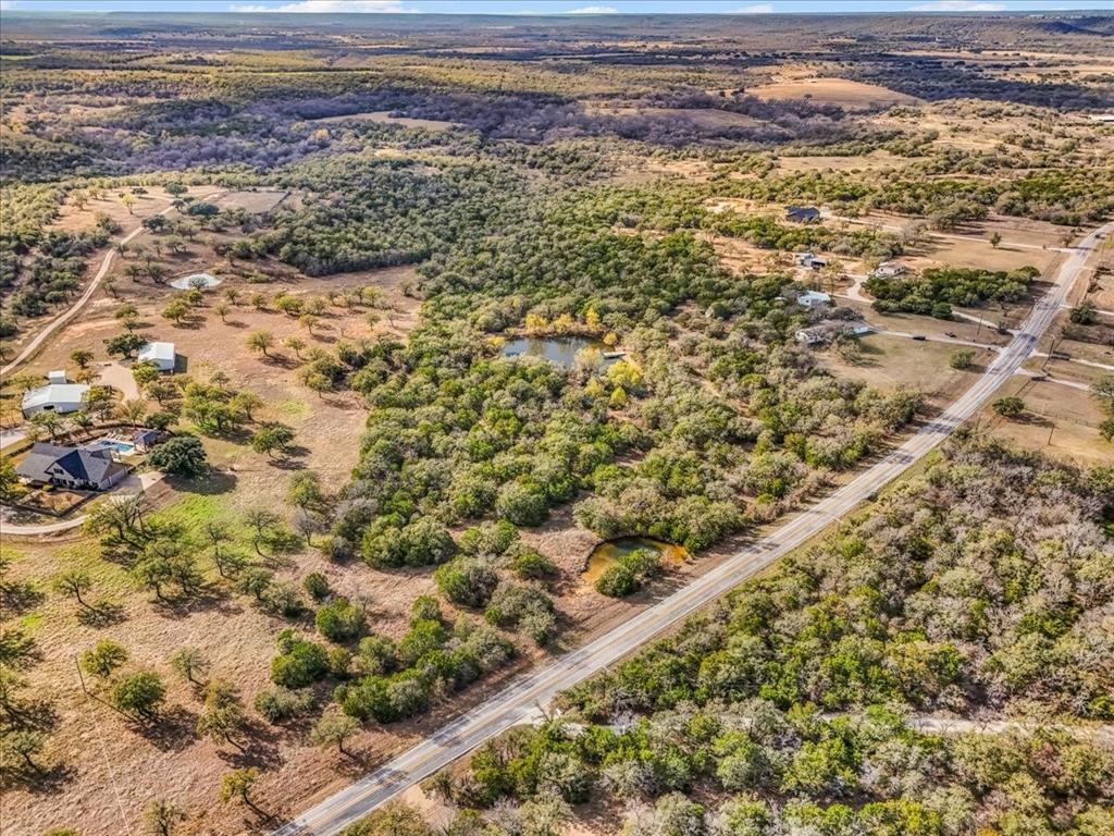 1956 North FM 129 Santo, TX 76472 - Photo 26 of 30 Aerial view of property and surrounding area featuring rural landscape