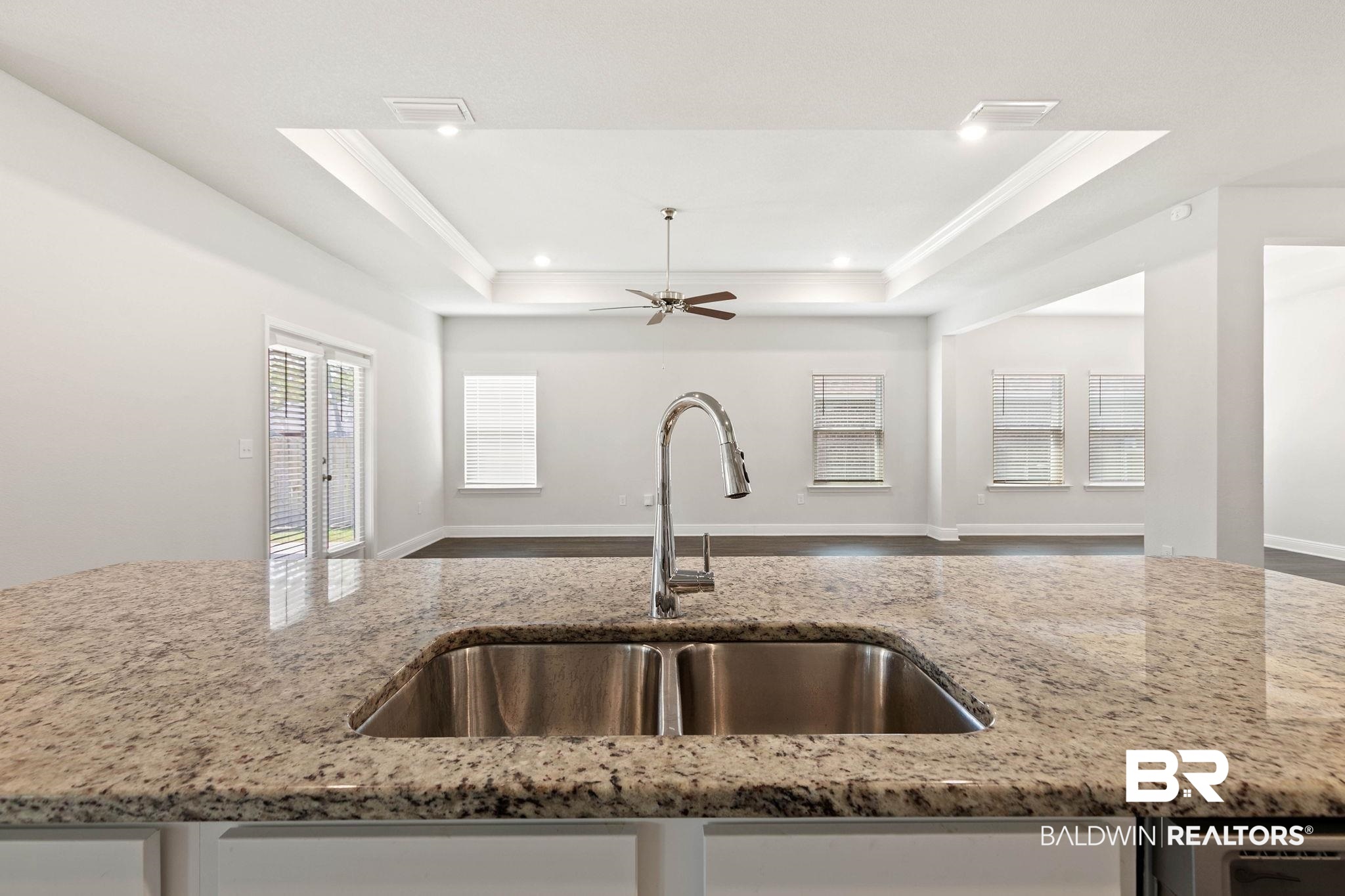 9448 Amethyst Drive Daphne, AL 36526 - Photo 61 of 61 Kitchen featuring light stone countertops, ceiling fan, open floor plan, ornamental molding, and recessed lighting