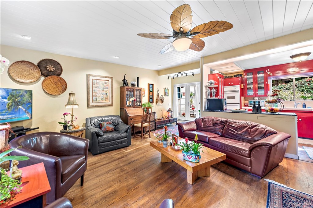 645 Griffith Way Laguna Beach, CA 92651 - Photo 11 of 55 a living room with furniture kitchen view and a large window