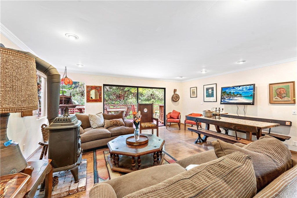 645 Griffith Way Laguna Beach, CA 92651 - Photo 25 of 55 a living room with furniture a rug and a large window