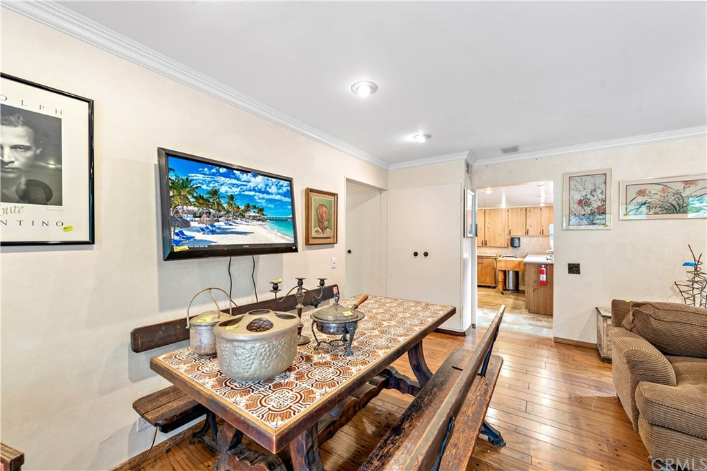 645 Griffith Way Laguna Beach, CA 92651 - Photo 28 of 55 a view of a dining room with furniture a rug and wooden floor