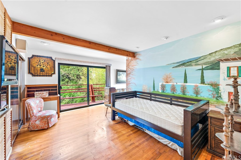 645 Griffith Way Laguna Beach, CA 92651 - Photo 32 of 55 a bed sitting in a bedroom next to a window