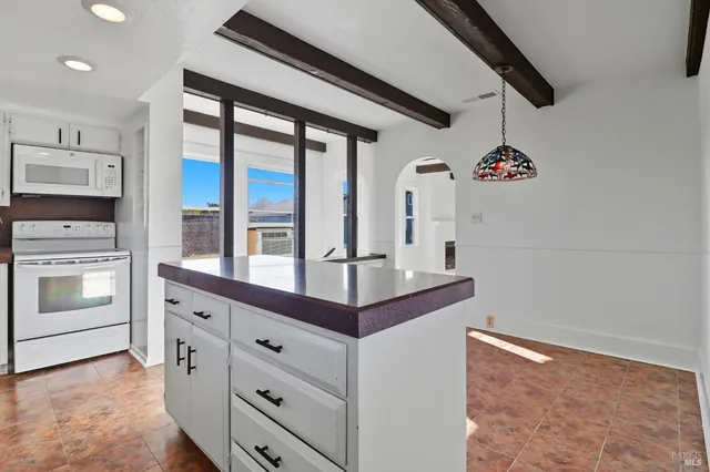 a view of a hallway with washer and dryer