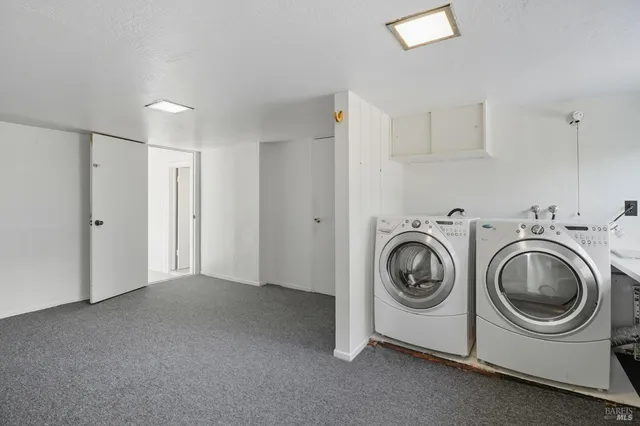 a view of a storage & utility room with washer and dryer
