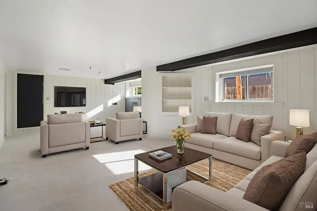 a living room with furniture and a couch