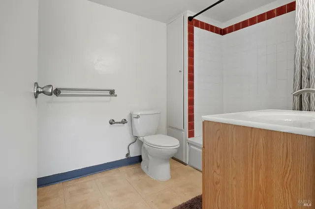 a bathroom with a toilet and a sink