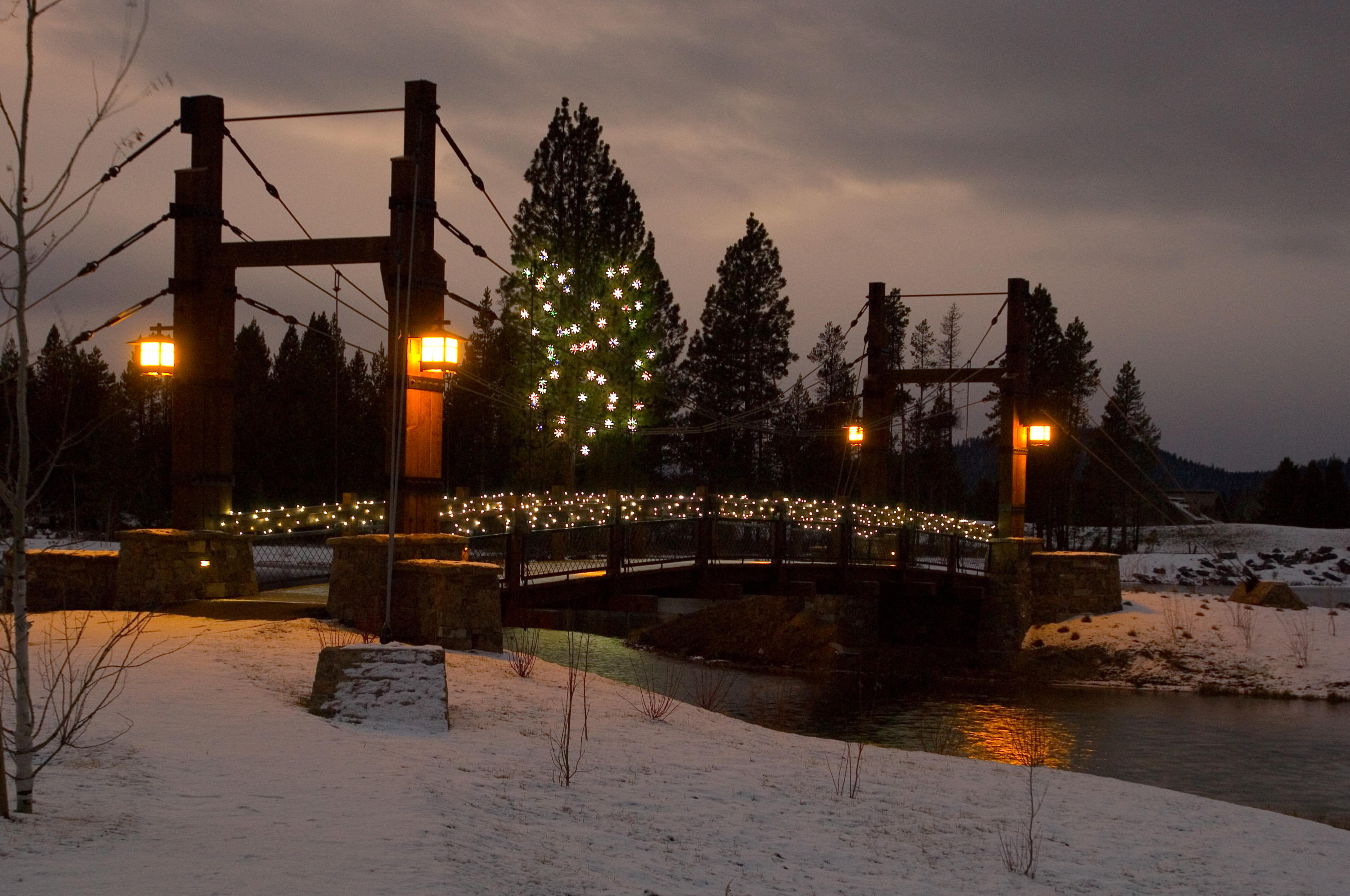 56755 Dancing Rock Loop Bend, OR 97707 - Photo 4 of 28 Caldera Springs is the perfect place to snow shoe in the Winter. We love the way the HOA decorates the Obsidian Lake bridge for the Holidays.