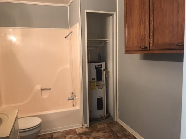 5925 Fulton Road Springfield, TN 37172 - Photo 16 of 18 a bathroom with a shower and a toilet
