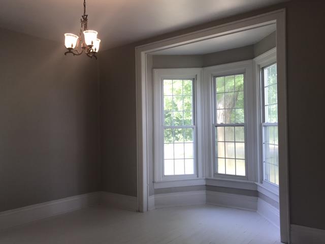 5925 Fulton Road Springfield, TN 37172 - Photo 6 of 18 a view of a livingroom with a chandelier curtains and large windows