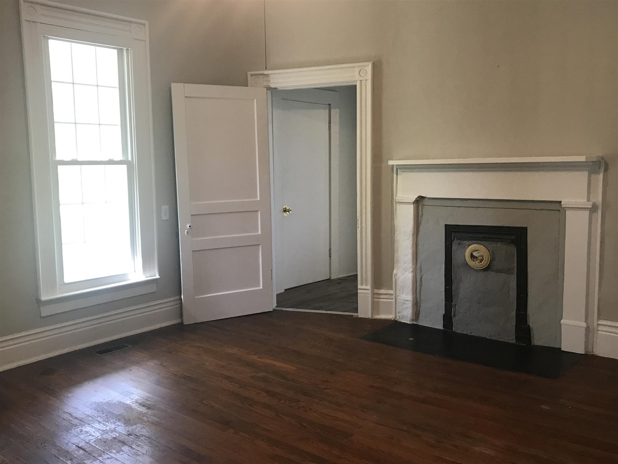 5925 Fulton Road Springfield, TN 37172 - Photo 8 of 18 an empty room with wooden floor closet and windows