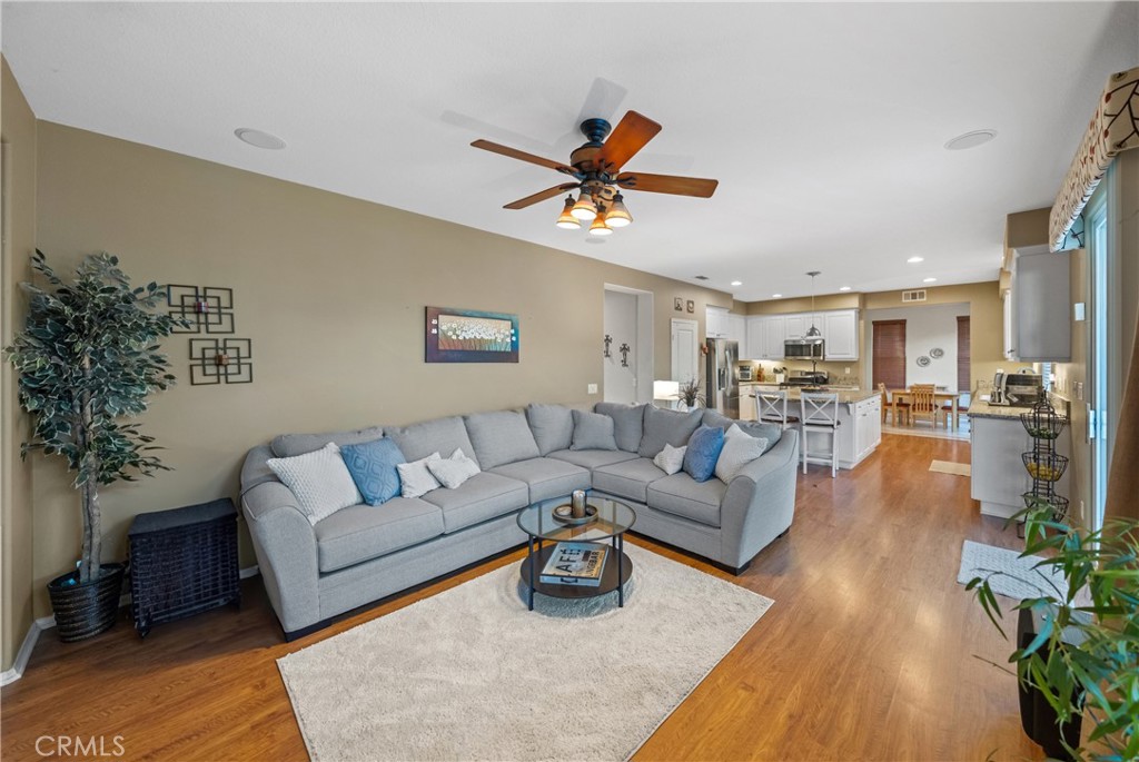29248 Easton Place Temecula, CA 92591 - Photo 11 of 47 a living room with furniture kitchen view and a potted plant