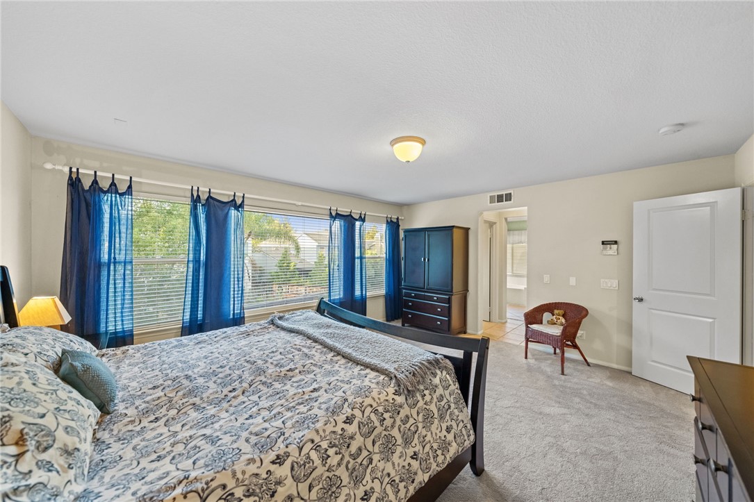 29248 Easton Place Temecula, CA 92591 - Photo 21 of 47 a bed room with a bed and a chair