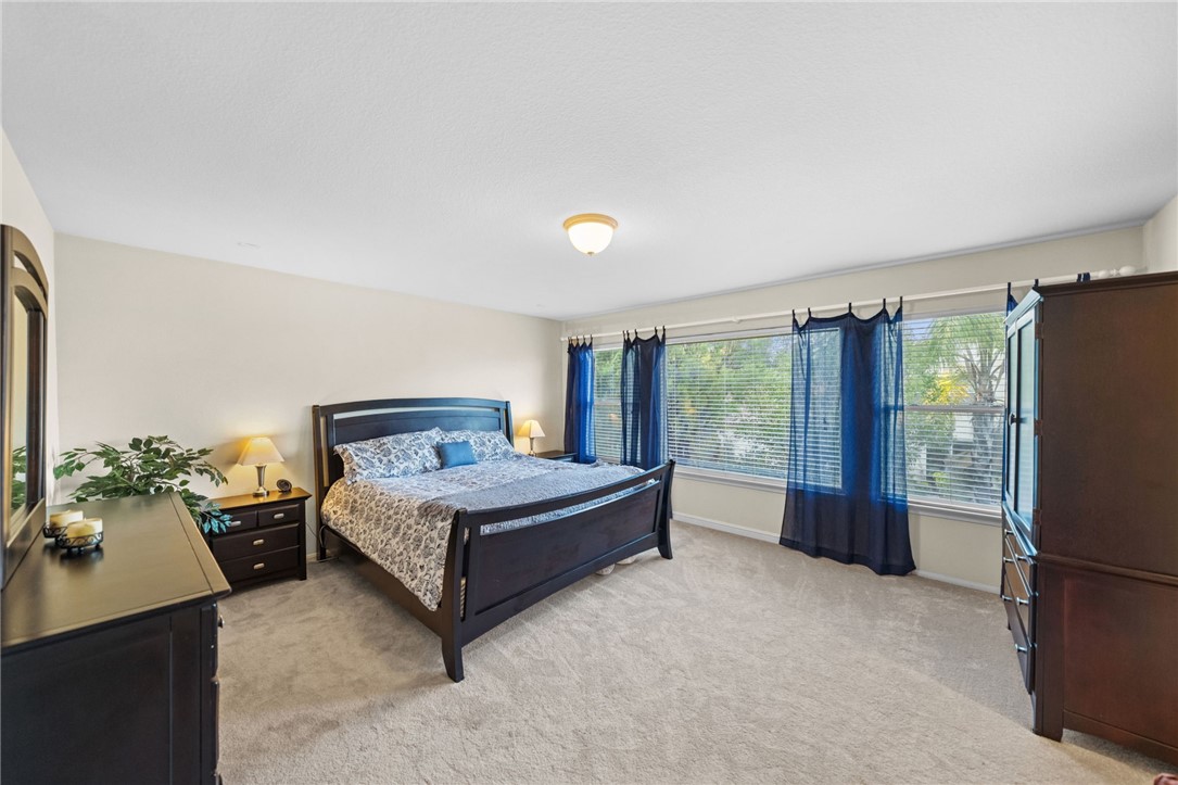 29248 Easton Place Temecula, CA 92591 - Photo 22 of 47 a bedroom with a bed and large window