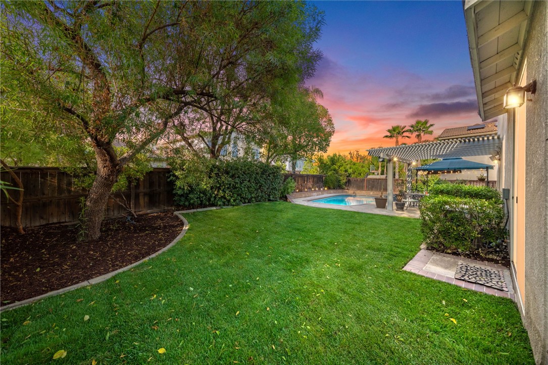 29248 Easton Place Temecula, CA 92591 - Photo 3 of 47 a view of a garden with a building in the background