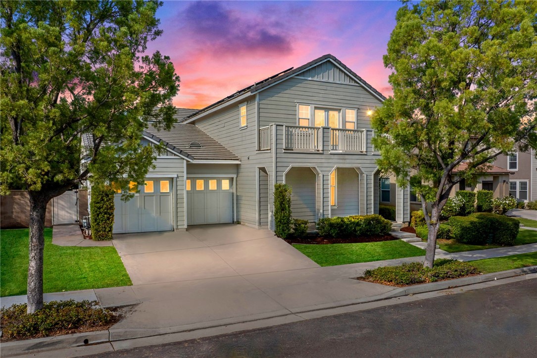 29248 Easton Place Temecula, CA 92591 - Photo 44 of 47 a front view of a house with a yard and garage