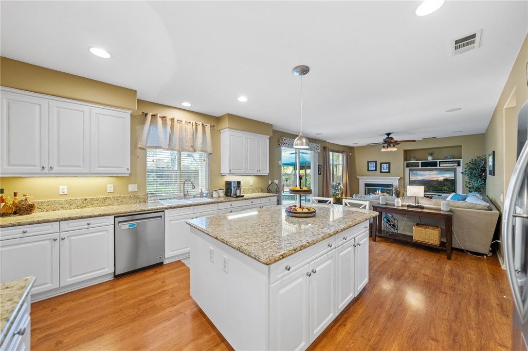 29248 Easton Place Temecula, CA 92591 - Photo 5 of 47 a large kitchen with a center island and stainless steel appliances