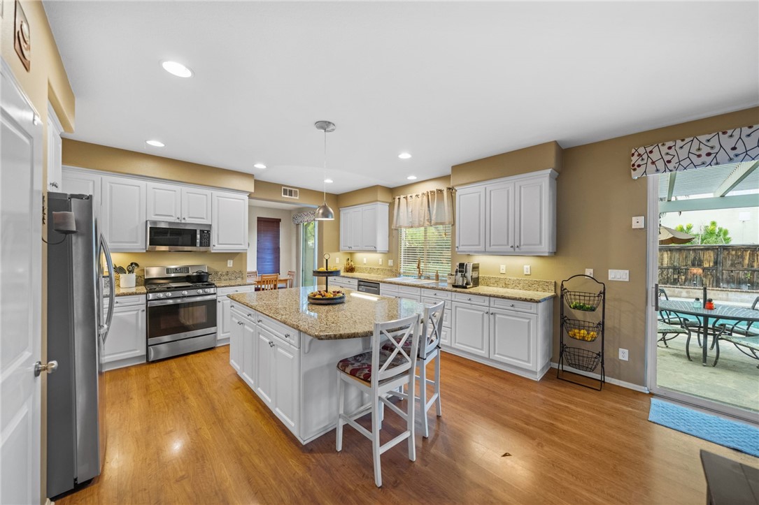 29248 Easton Place Temecula, CA 92591 - Photo 6 of 47 a kitchen with a sink stainless steel appliances and cabinets