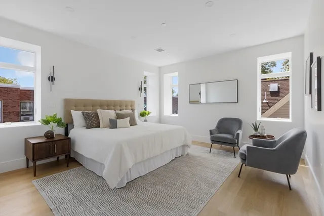 a bedroom with a bed and a couch