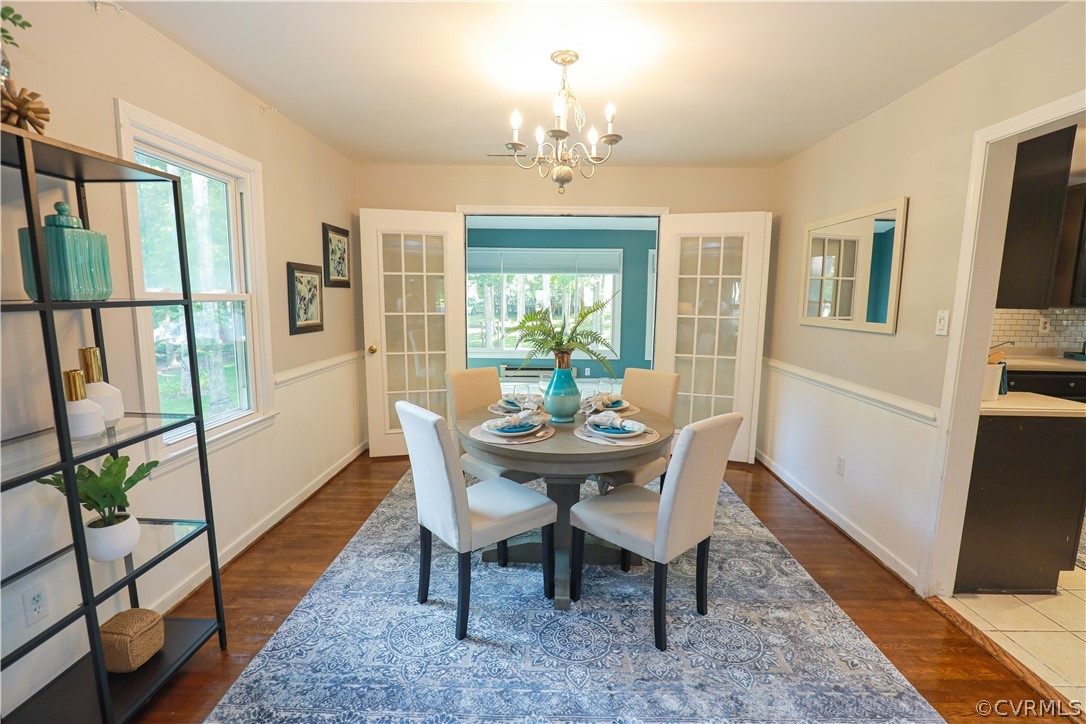 12935 Ashtree Road Midlothian, VA 23114 - Photo 12 of 50 a view of a dining room with furniture window and wooden floor