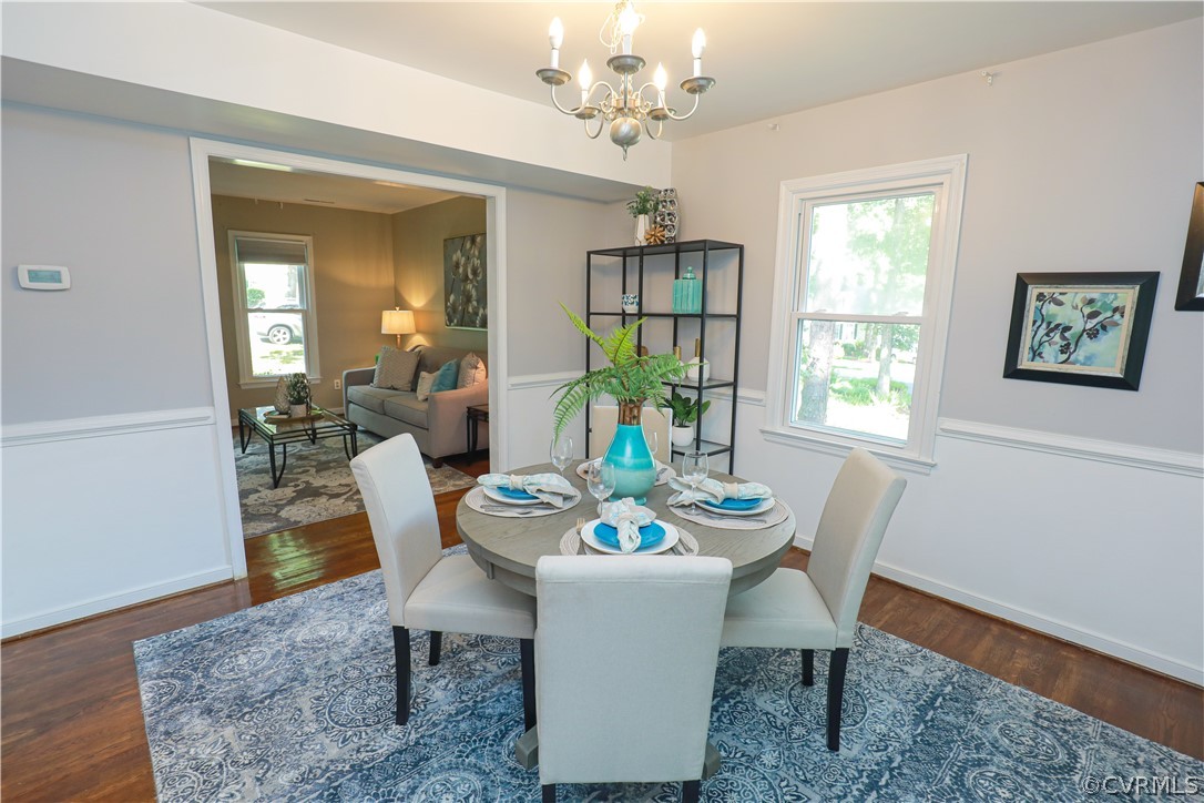 12935 Ashtree Road Midlothian, VA 23114 - Photo 13 of 50 a dining room with furniture a rug and wooden floor