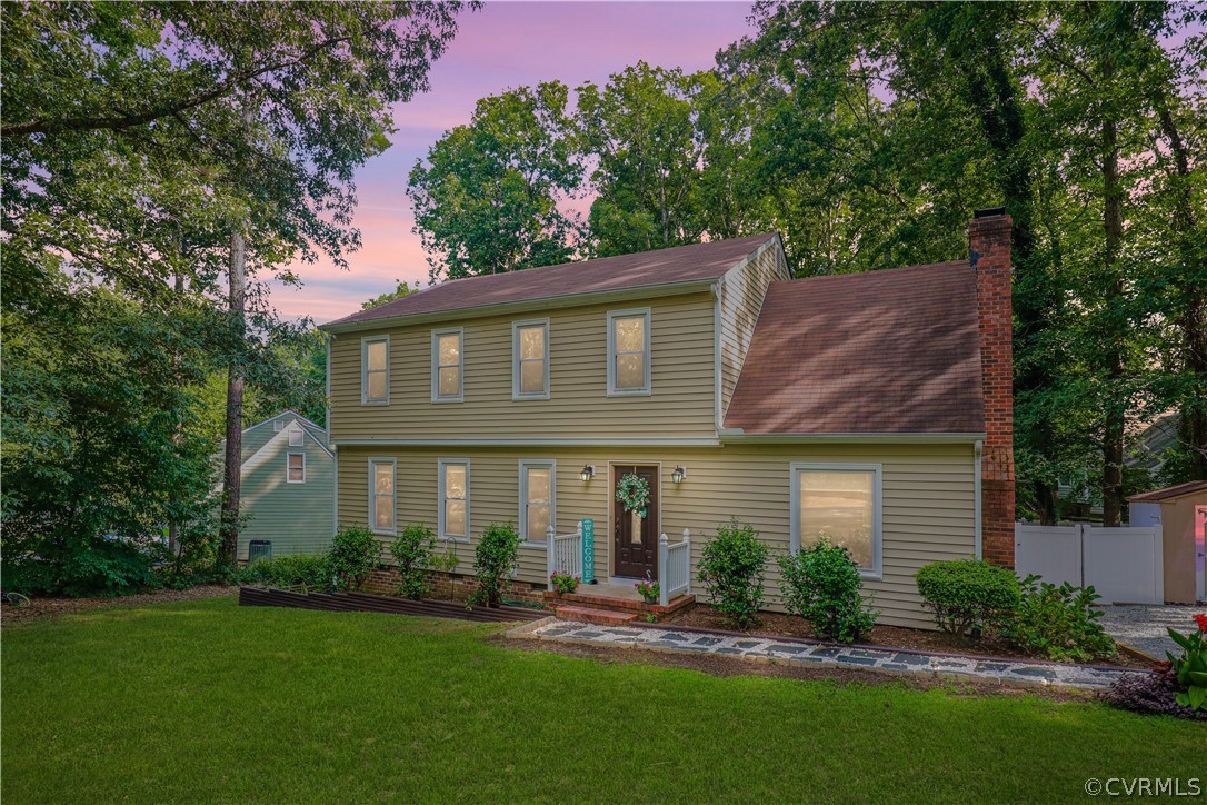 12935 Ashtree Road Midlothian, VA 23114 - Photo 2 of 50 a front view of a house with a yard and green space