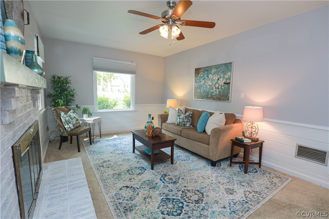 12935 Ashtree Road Midlothian, VA 23114 - Photo 22 of 50 a living room with furniture and a fireplace