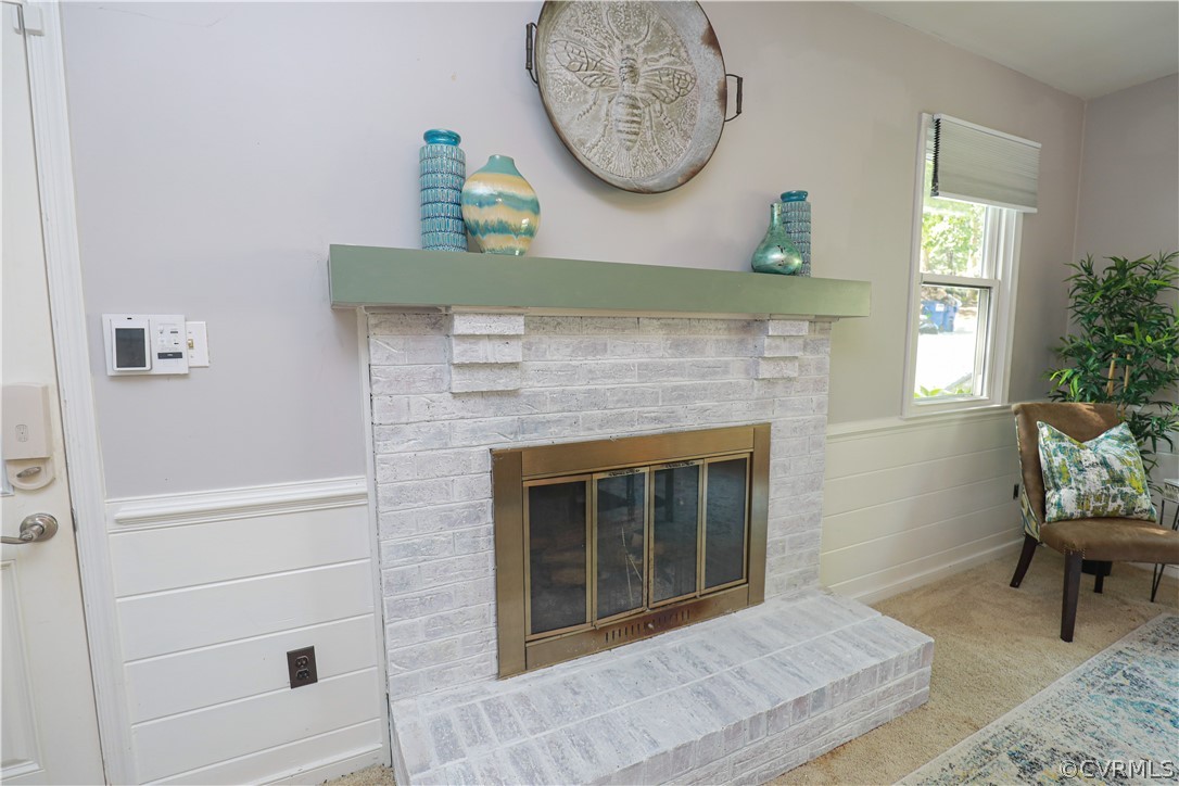 12935 Ashtree Road Midlothian, VA 23114 - Photo 23 of 50 a living room with furniture and a fireplace