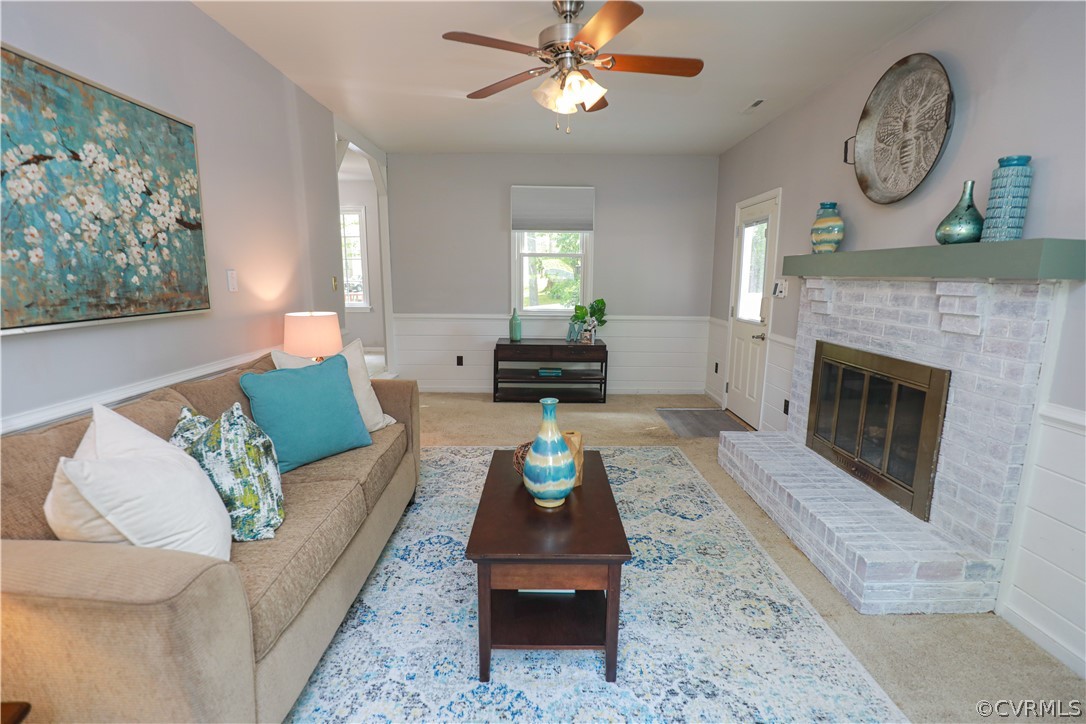 12935 Ashtree Road Midlothian, VA 23114 - Photo 24 of 50 a living room with furniture and a fireplace