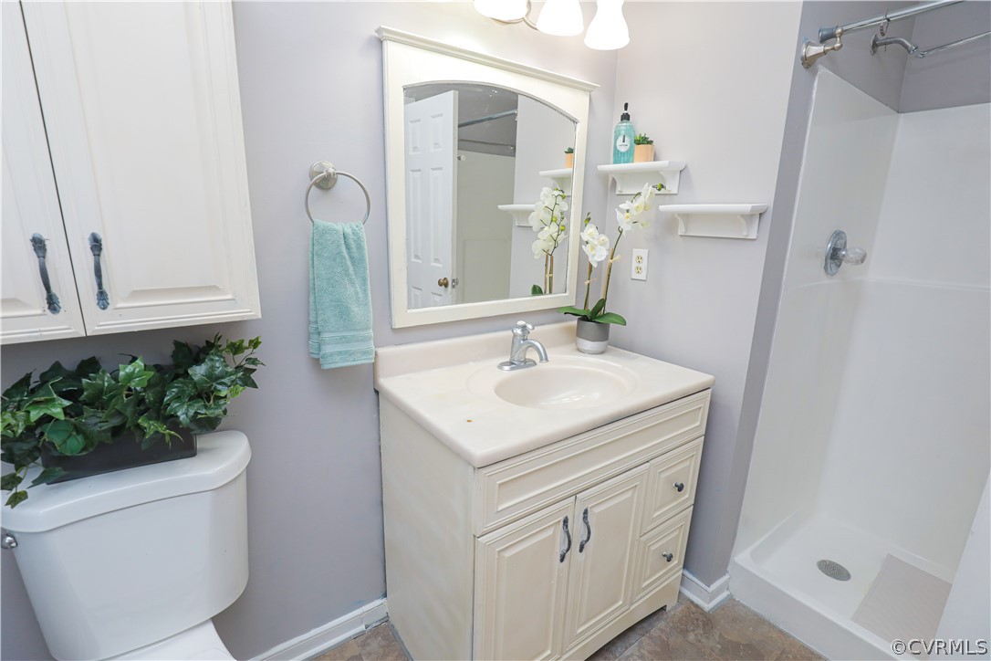 12935 Ashtree Road Midlothian, VA 23114 - Photo 33 of 50 a bathroom with a sink toilet and shower