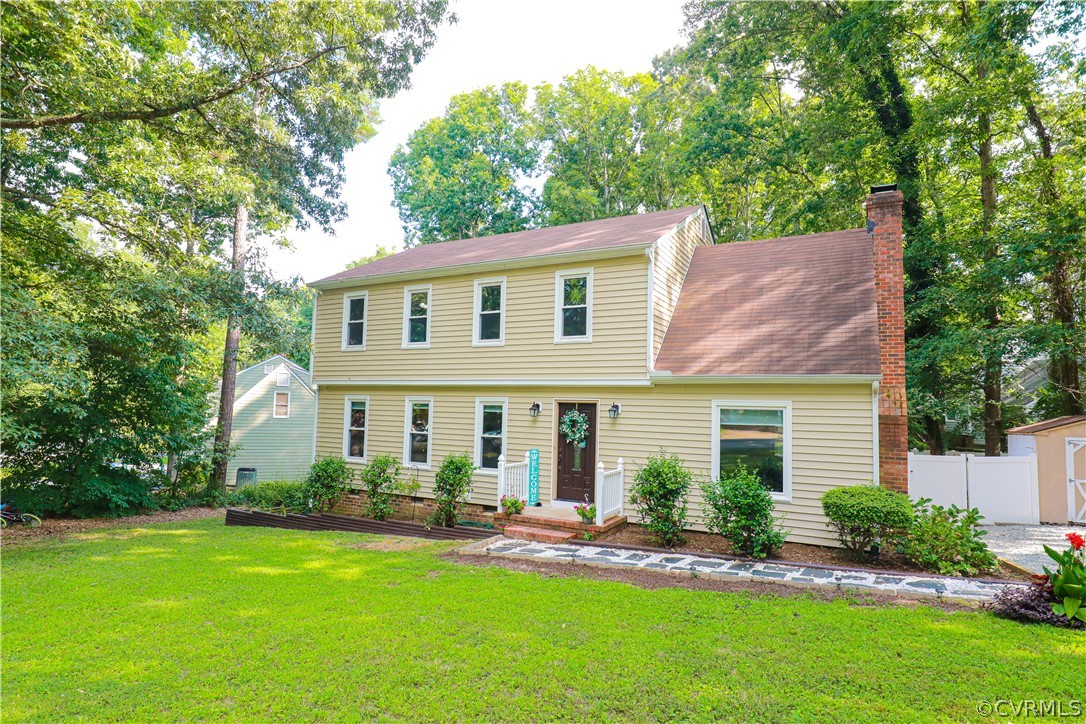 12935 Ashtree Road Midlothian, VA 23114 - Photo 4 of 50 a front view of a house with a yard and porch
