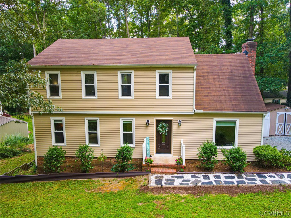 12935 Ashtree Road Midlothian, VA 23114 - Photo 50 of 50 a front view of a house with a garden and plants