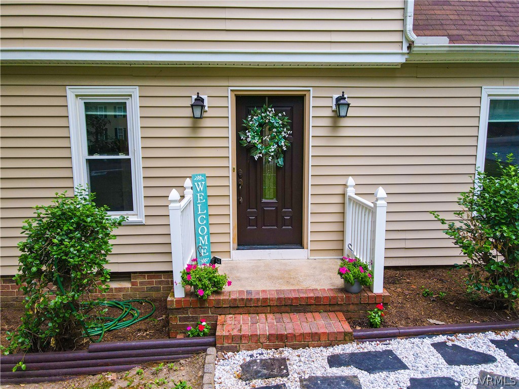 12935 Ashtree Road Midlothian, VA 23114 - Photo 5 of 50 a front view of a house with plants