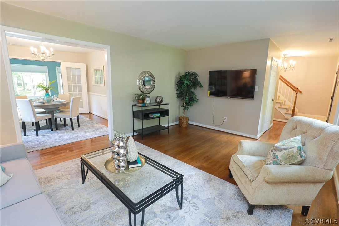12935 Ashtree Road Midlothian, VA 23114 - Photo 10 of 50 a living room with furniture and a flat screen tv