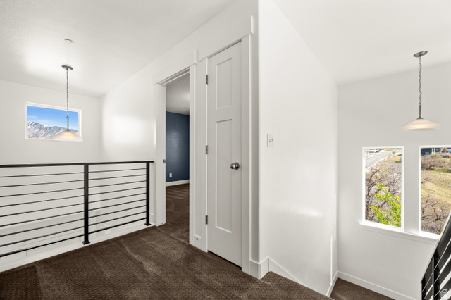 14728 South Canyon Pointe Road Draper, UT 84020 - Photo 22 of 35 Upper-level hallway with dark carpeting and bright white walls