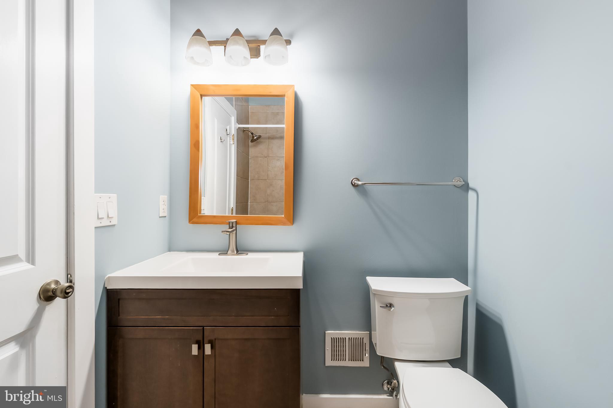 1553 9th Street Northwest, Unit A Washington, DC 20001 - Photo 11 of 30 a bathroom with a sink and a mirror