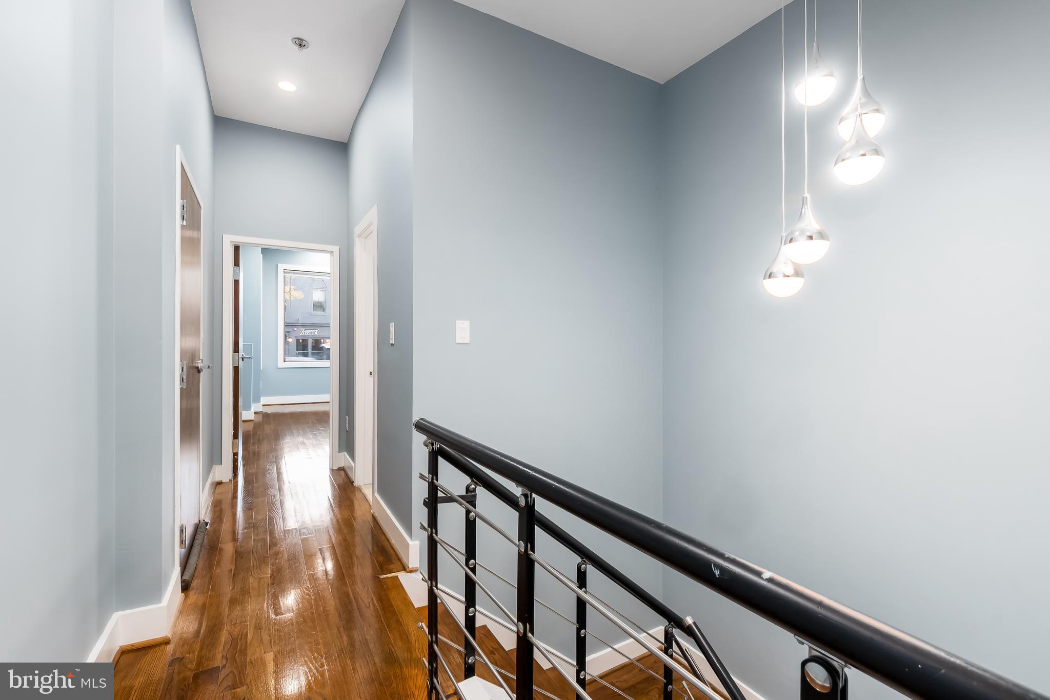 1553 9th Street Northwest, Unit A Washington, DC 20001 - Photo 13 of 30 a view of a hallway with wooden floor
