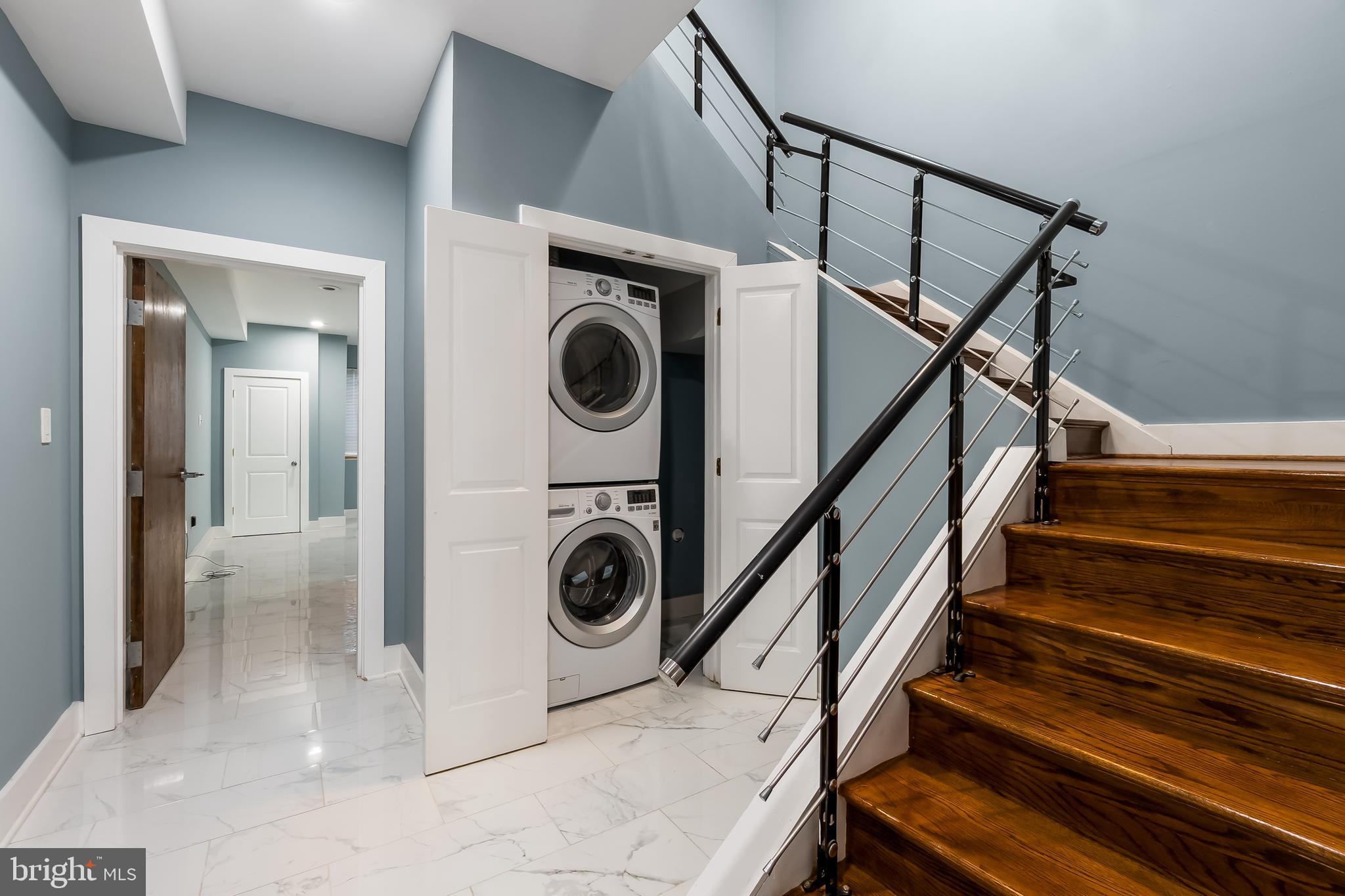 1553 9th Street Northwest, Unit A Washington, DC 20001 - Photo 28 of 30 a utility room with wooden floor and washing machine