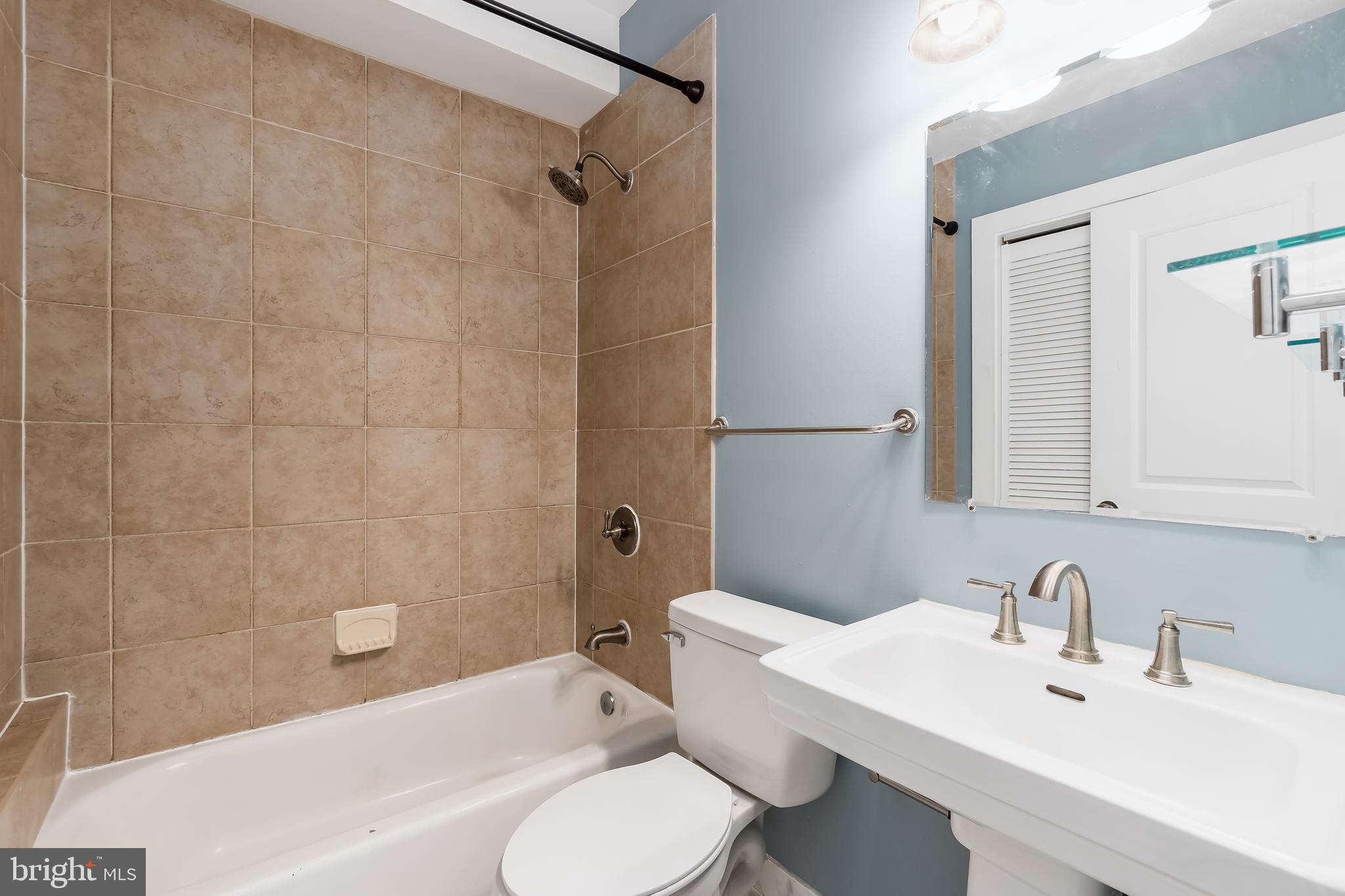 1553 9th Street Northwest, Unit A Washington, DC 20001 - Photo 18 of 30 a bathroom with a sink toilet and shower