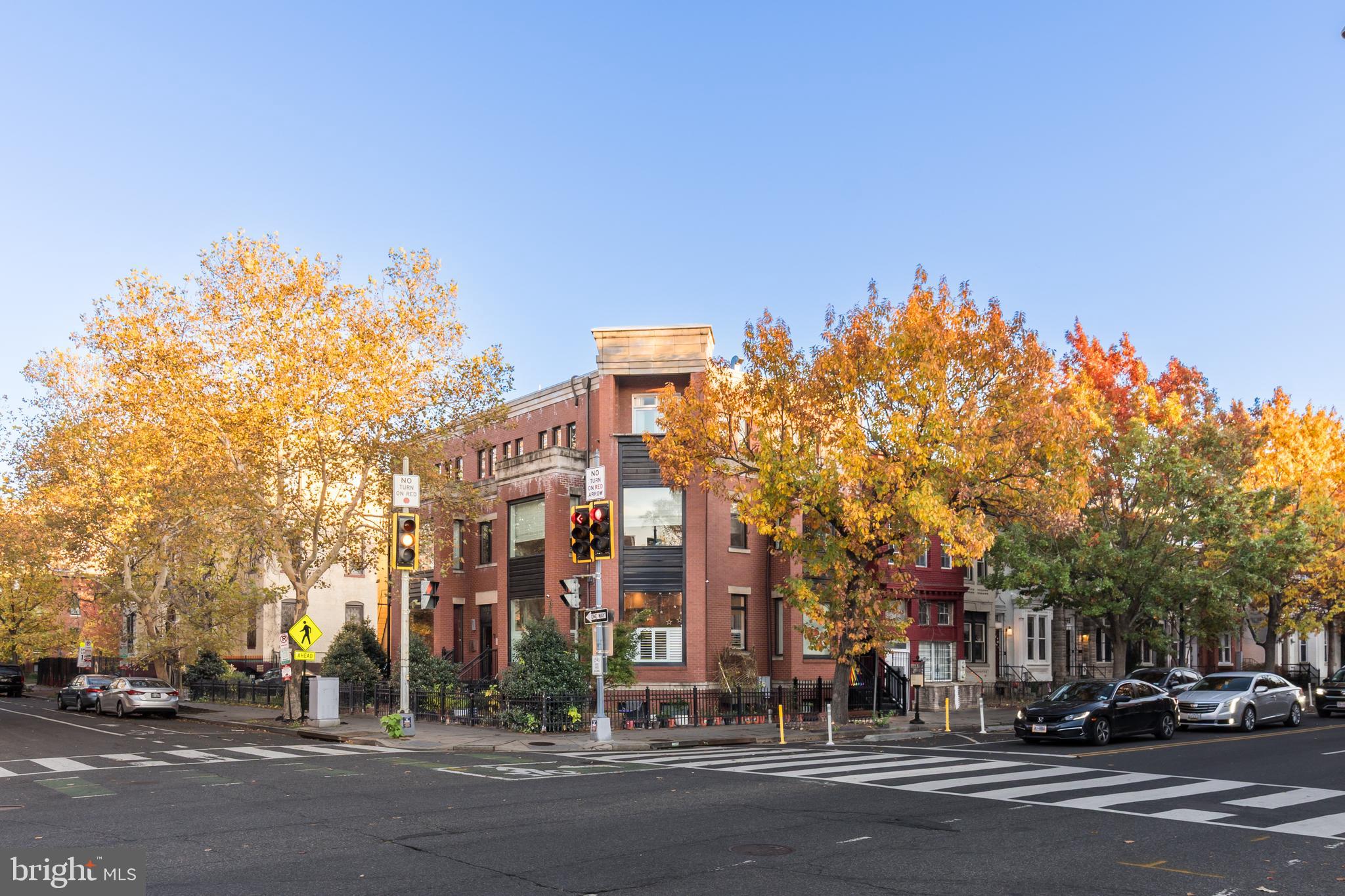1553 9th Street Northwest, Unit A Washington, DC 20001 - Photo 26 of 30 a city street lined with buildings and trees