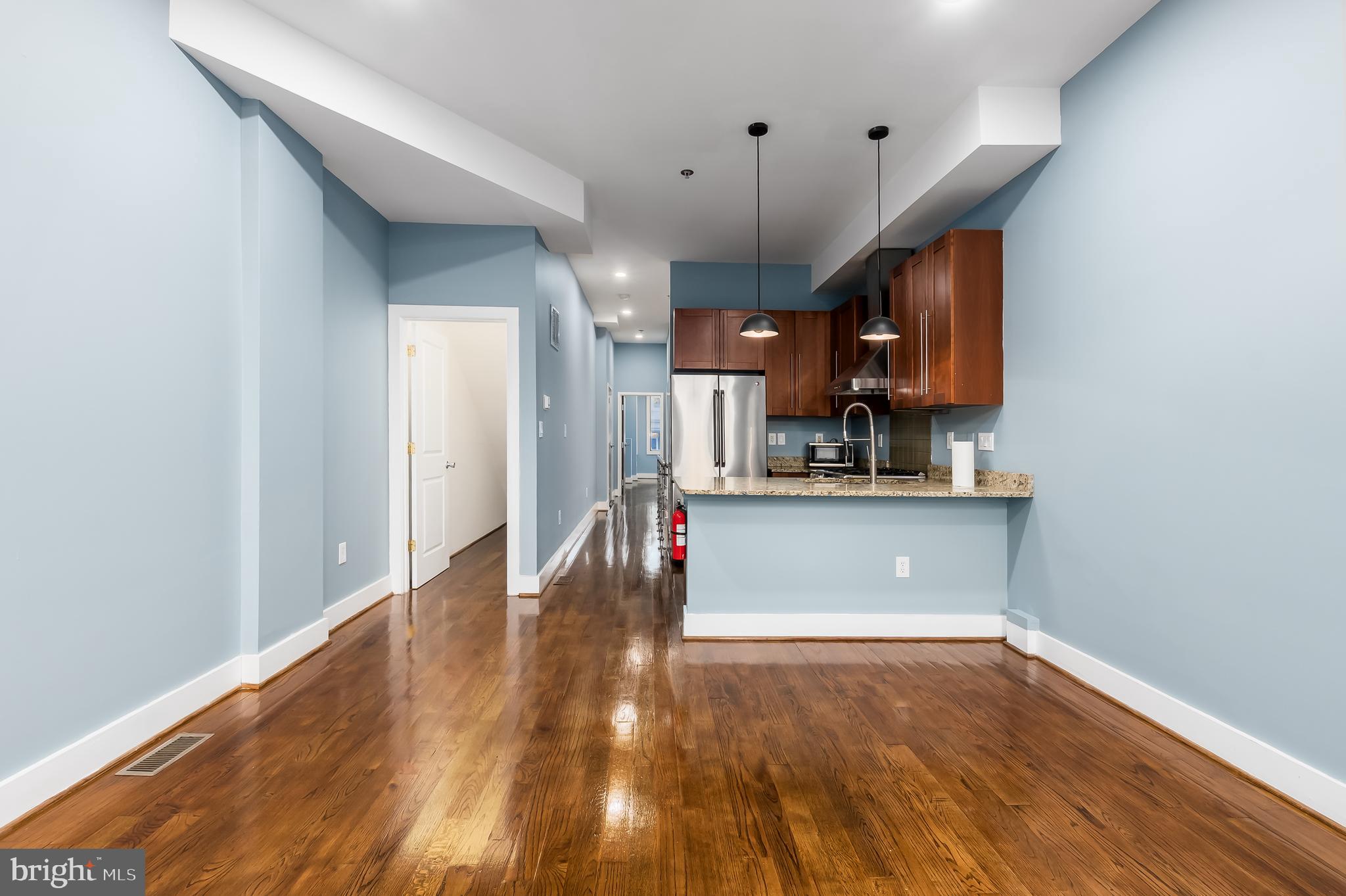 1553 9th Street Northwest, Unit A Washington, DC 20001 - Photo 5 of 30 a view of a kitchen with a sink and cabinets