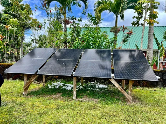 an aerial view of a house with yard