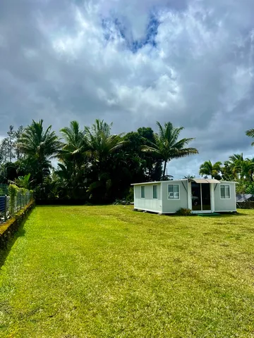a view of a swimming pool with a yard