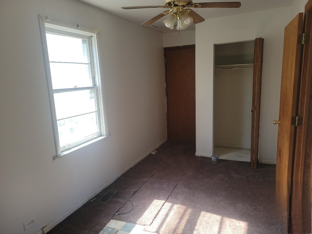 2100 14th Avenue Broadview, IL 60155 - Photo 6 of 14 an empty room with a window