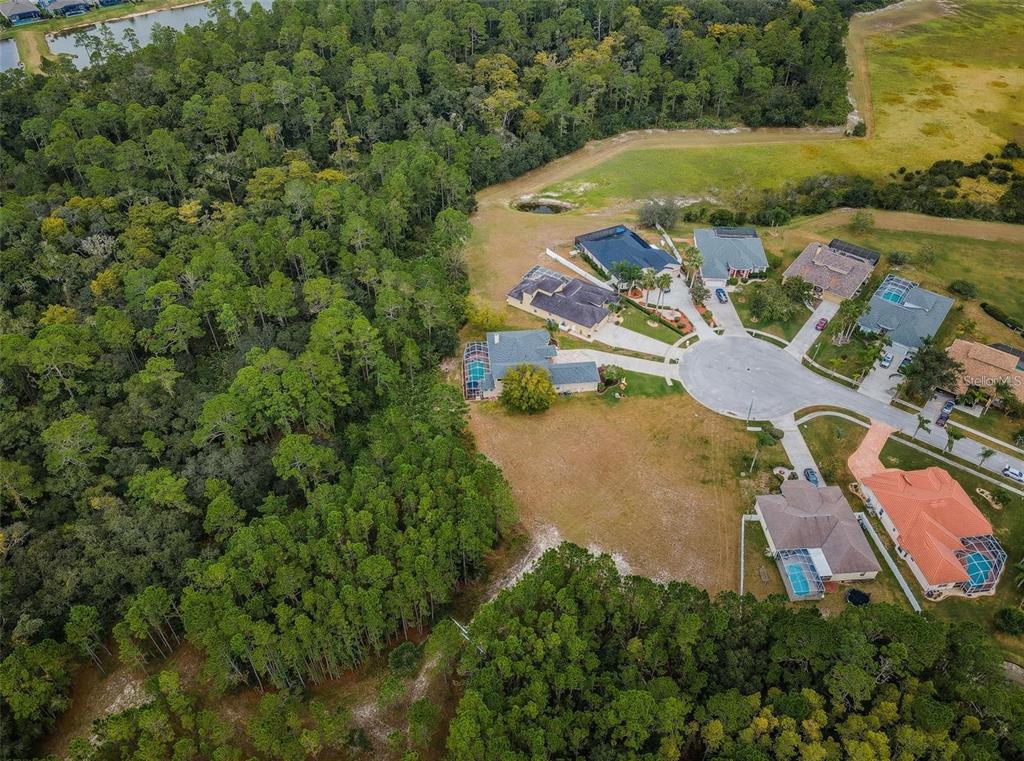 0 Shooting Star Court New Port Richey, FL 34655 - Photo 13 of 23 an aerial view of residential houses with outdoor space and swimming pool