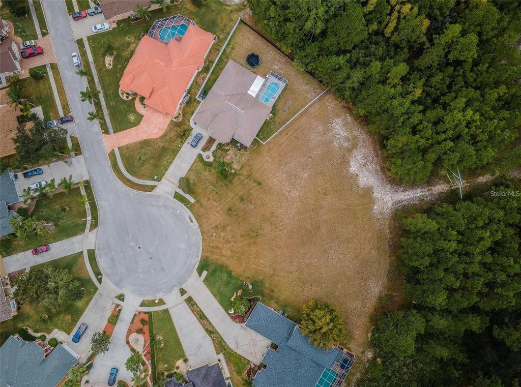 0 Shooting Star Court New Port Richey, FL 34655 - Photo 9 of 23 an aerial view of a house with a swimming pool