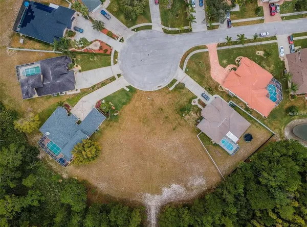 an aerial view of a house with a swimming pool